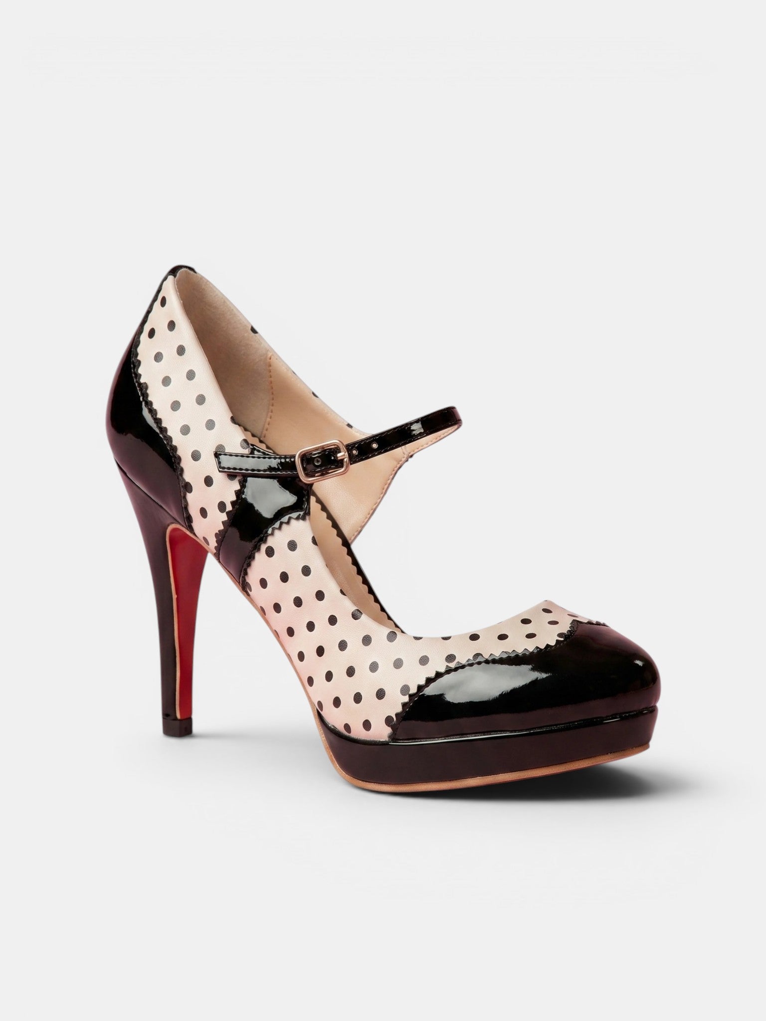 Polka dot high-heeled shoe on a white background